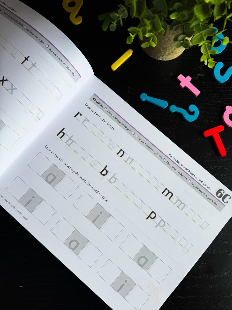 Spelling You See Level A handwriting worksheet featuring lowercase letter tracing and review of short vowel sounds.