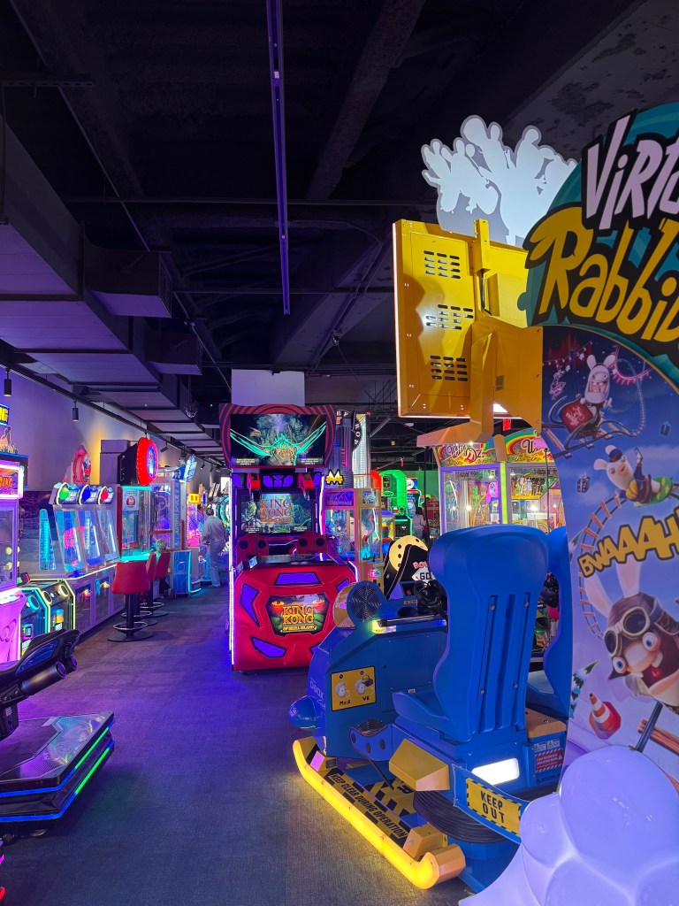 Arcade games inside Northern Lights Arcade at Great Wolf Lodge Grapevine, including virtual reality and interactive games.