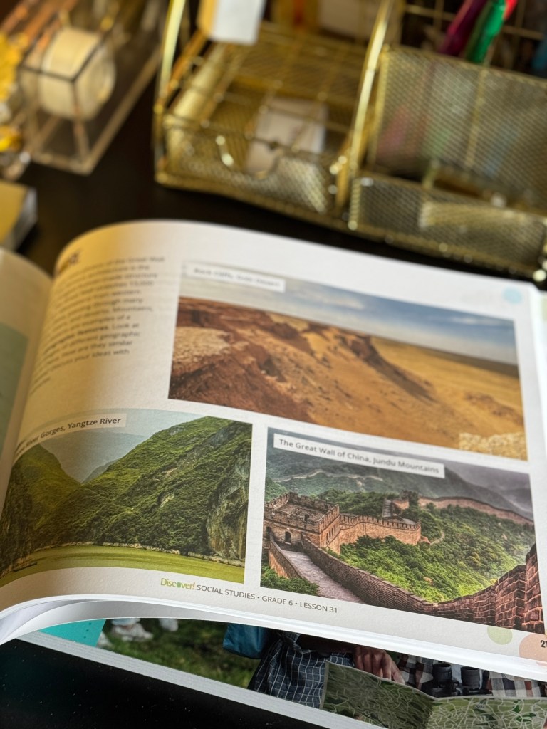 An open educational book page featuring the Yangtze River gorges and the Great Wall of China in the Jundu Mountains, designed for a Grade 6 social studies lesson.