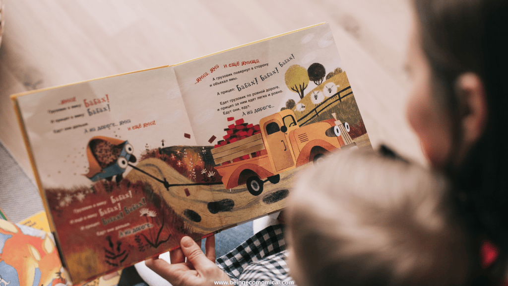 Child looking at a colorful picture book during a preschool reading activity