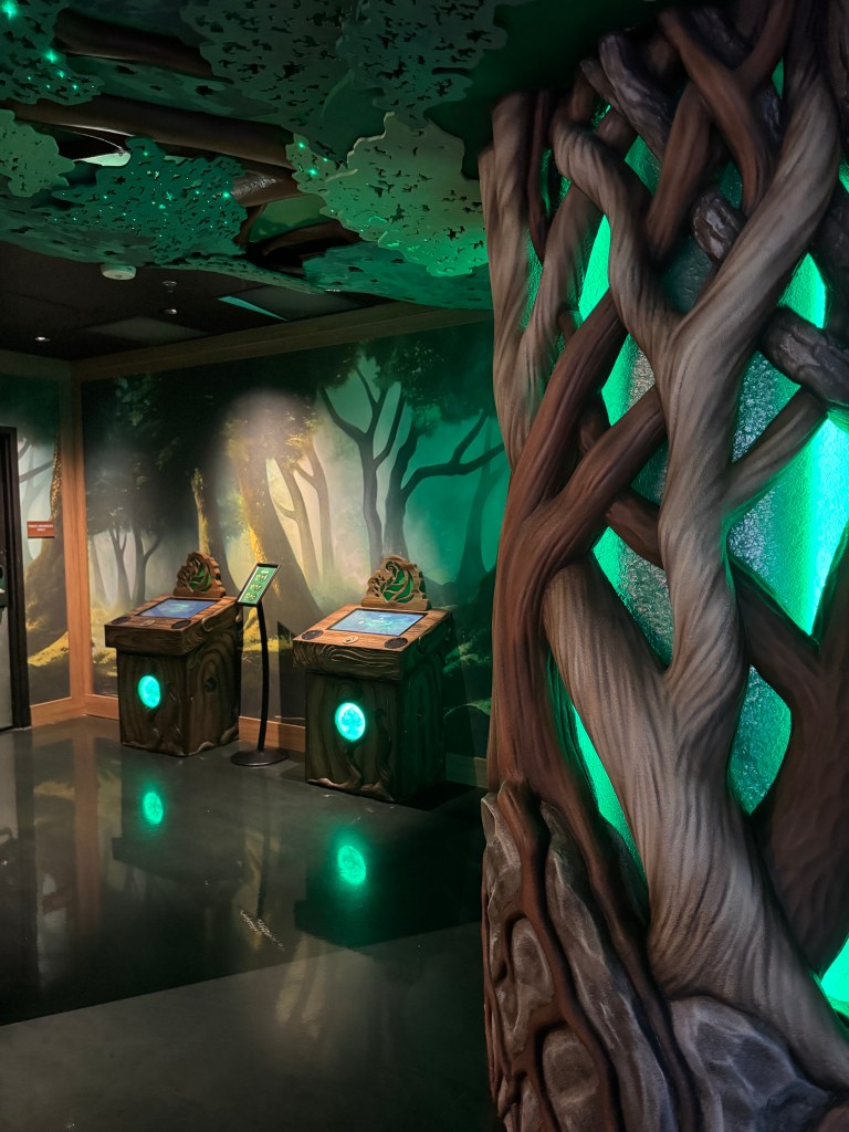 MagiQuest game stations inside Great Wolf Lodge Grapevine with glowing forest-themed interactive displays.
