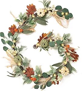 A decorative autumn wreath featuring greenery, pumpkins, and colorful leaves, perfect for fall decorations.