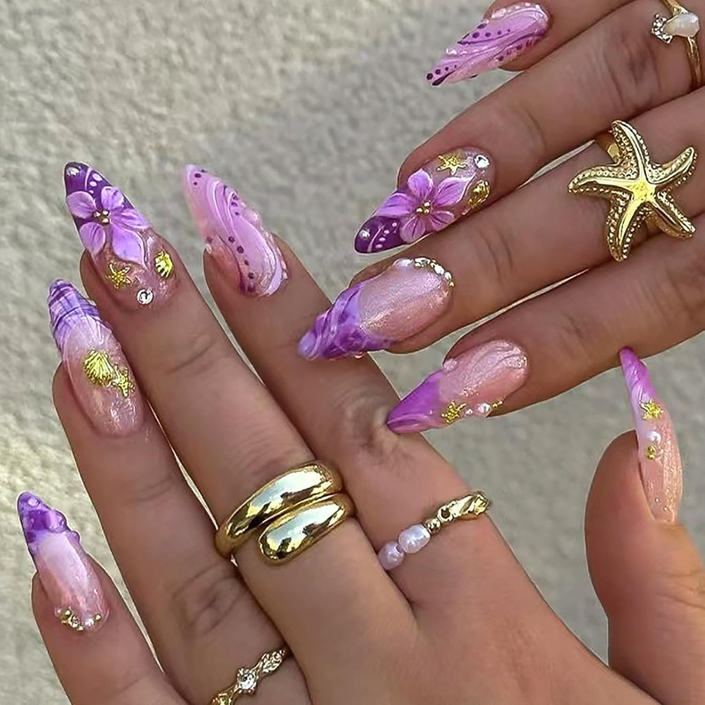 cute pink beach nails with starfish accents and striped design
