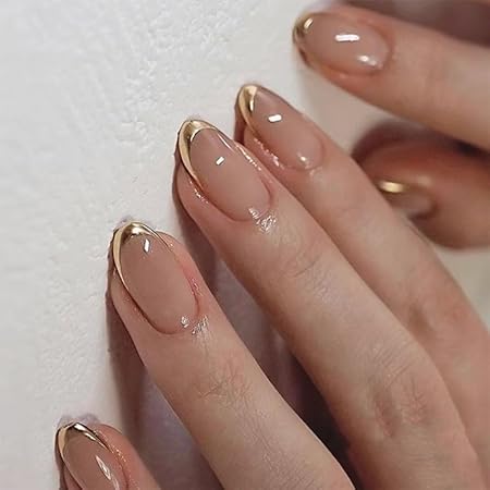 Elegant nude nails with a gold French tip design, showcasing a stylish and sophisticated look.