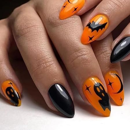 Bright orange nails with ghost and bat designs, accented by glossy black tips, perfect for Halloween.