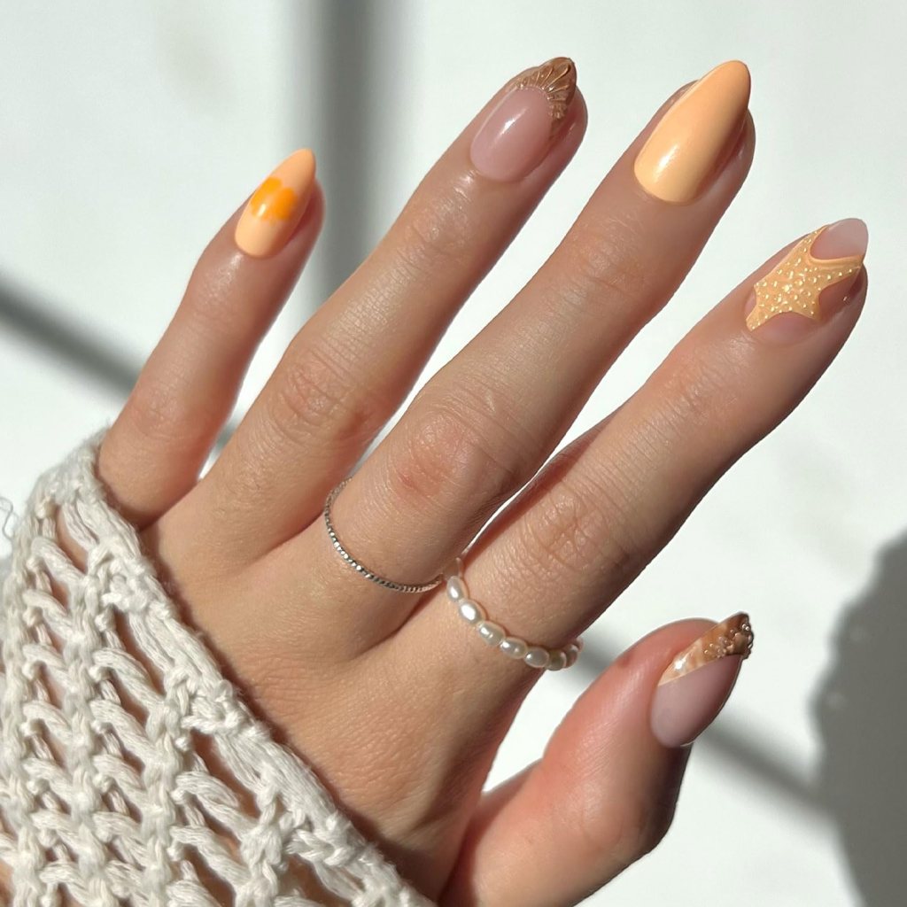 peach minimalist summer nails with glossy almond shape design
