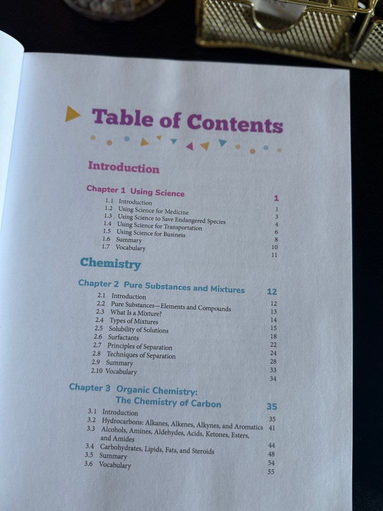 A colorful Table of Contents page from the 'Real Science 4 Kids Book 7' textbook, outlining chapters on Using Science, Chemistry, Organic Chemistry, and associated topics.