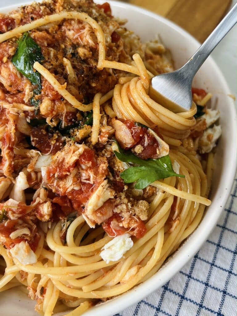Crab pasta with spaghetti and light tomato garlic sauce