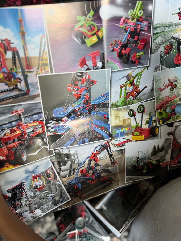 A collage of images featuring various designs built with a Fischer Technik STEM kit, showcasing creative vehicles, structures, and machines in bright colors.