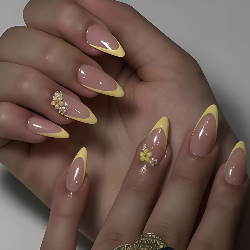 Glossy butter yellow French tip almond nails with soft nude base and elegant pastel manicure design