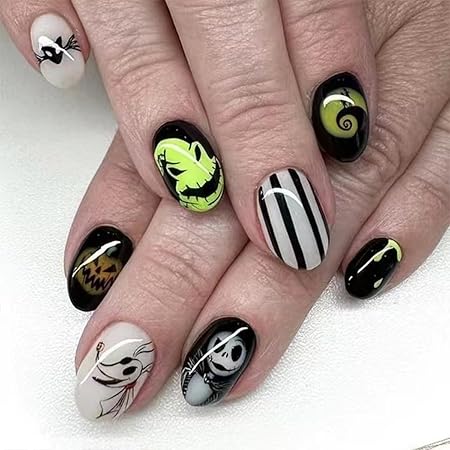 Nail design featuring characters and motifs from 'The Nightmare Before Christmas', with a mix of black, white, and green colors.