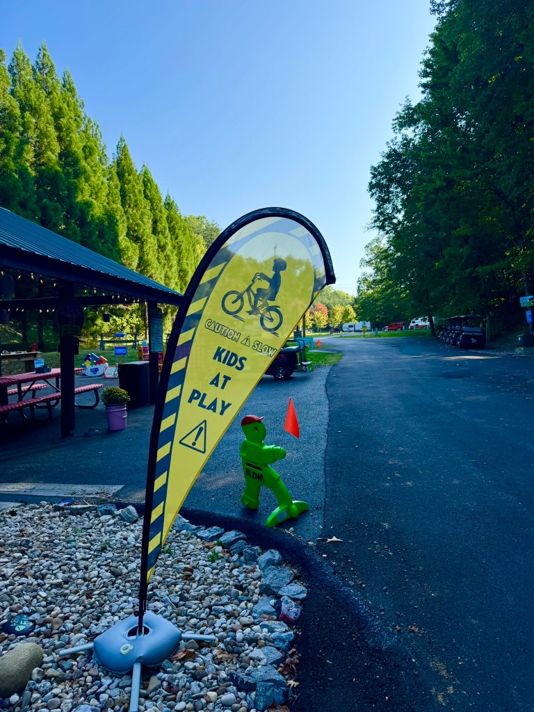 Kids at play safety sign along a campground road at Jellystone Park Pigeon Forge