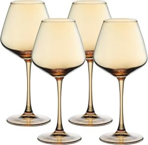 Set of four amber wine glasses with elegant stem design, ideal for enhancing Thanksgiving tablescapes.