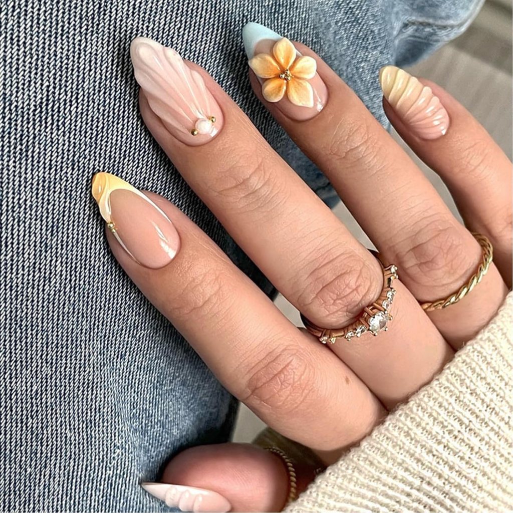 Butter yellow textured 3D flower nails with raised floral nail art and glossy pastel manicure design