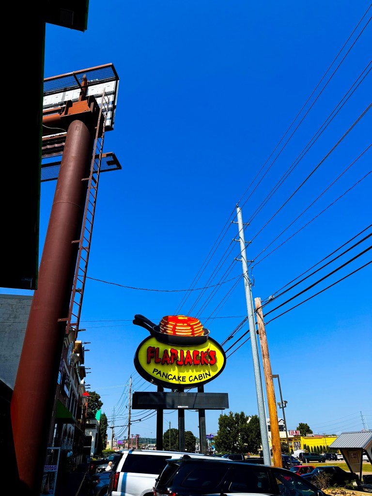 Colorful Flapjack's Pancake Cabin roadside sign along the Parkway in Pigeon Forge, Tennessee.