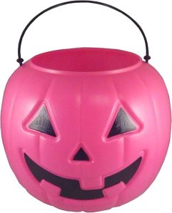 A pink plastic pumpkin bucket designed for Halloween, featuring a smiling jack-o'-lantern face and a black handle.
