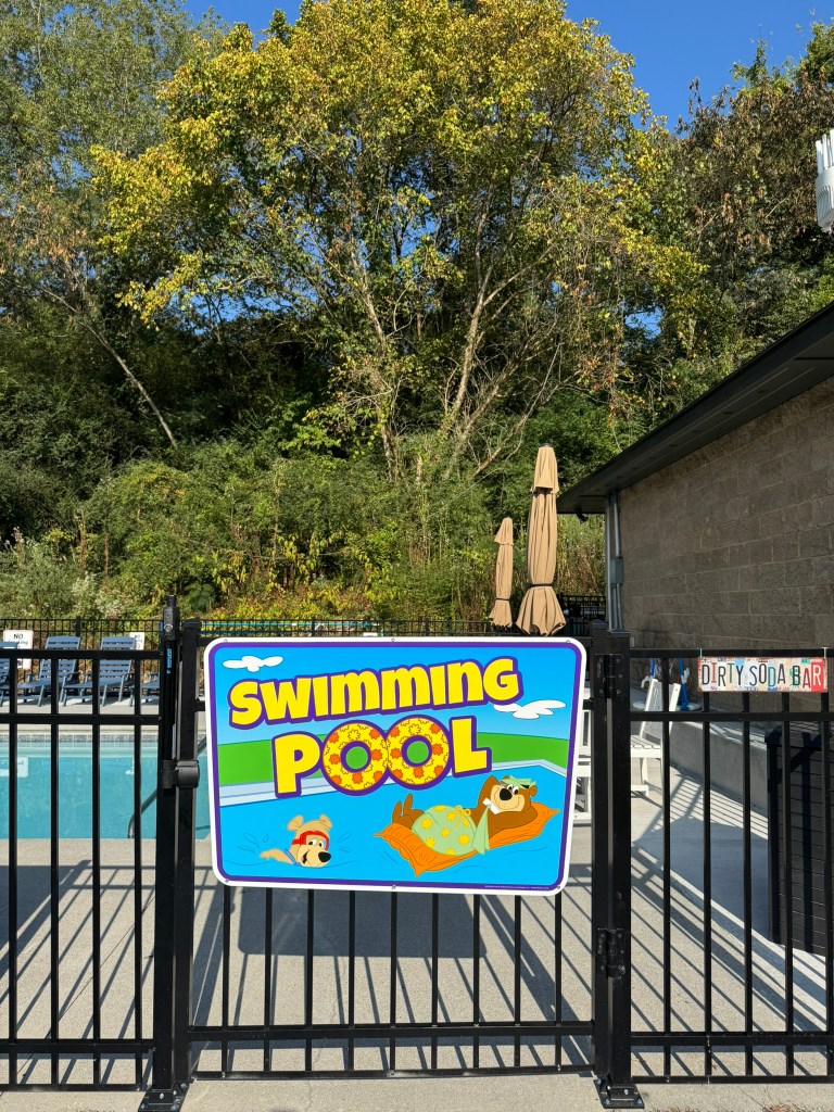Colorful swimming pool entrance sign at Jellystone Park Pigeon Forge