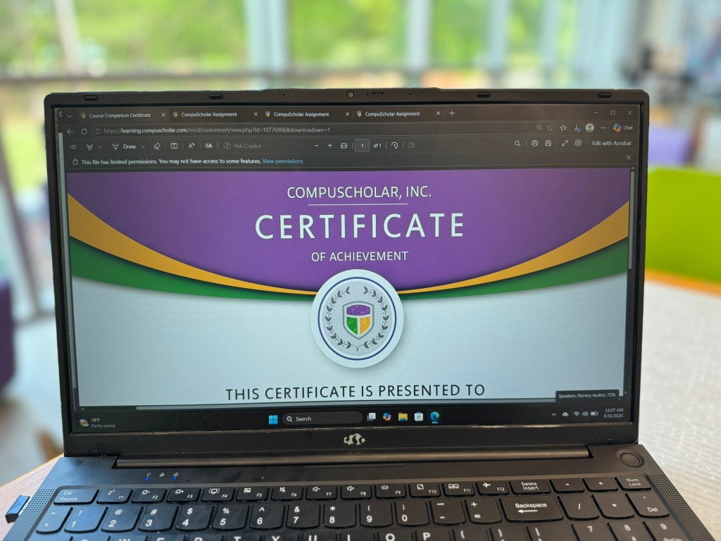 CompuScholar Unity course completion certificate displayed on laptop screen