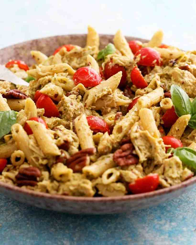 Creamy chicken pesto pasta salad with tender pasta and fresh pesto for an easy summer meal.