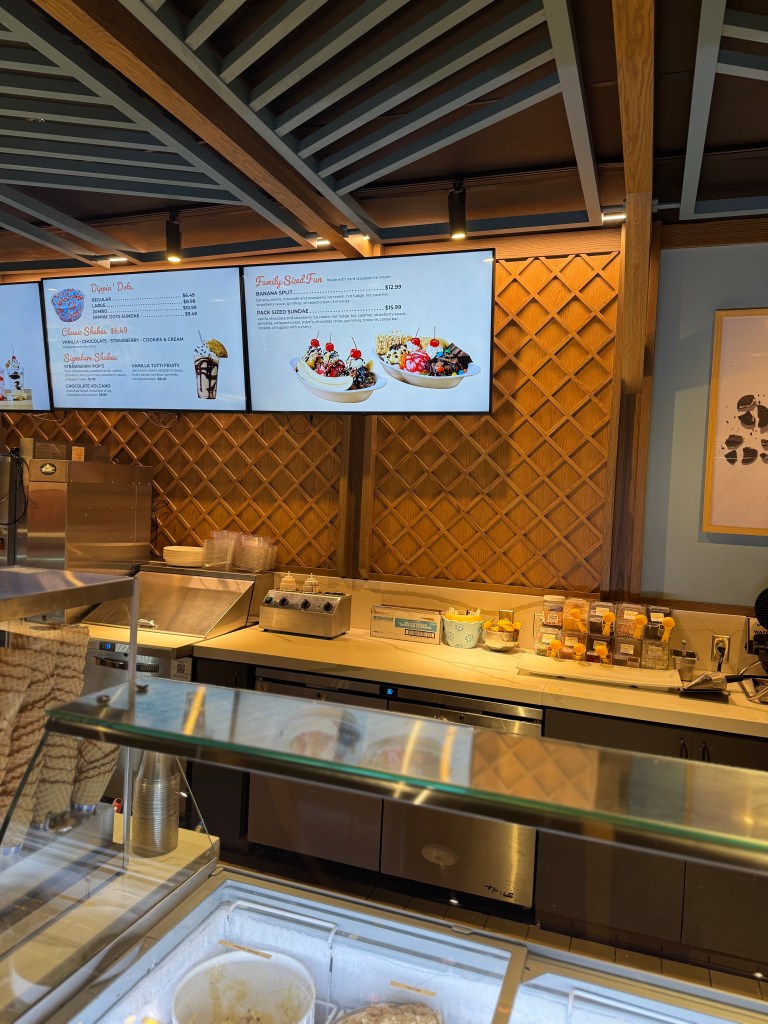 Ice cream counter at Great Wolf Lodge featuring a menu with various dessert options, including banana splits and family-sized treats.