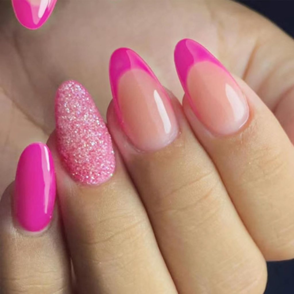 Close-up of manicured nails featuring a mix of pink and glitter nail polish, with some nails having a glossy pink tip design.