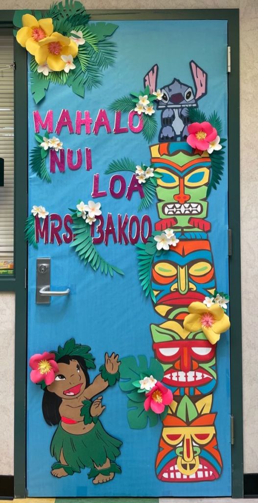 tiki tropical classroom door with palm trees and Hawaiian theme decorations