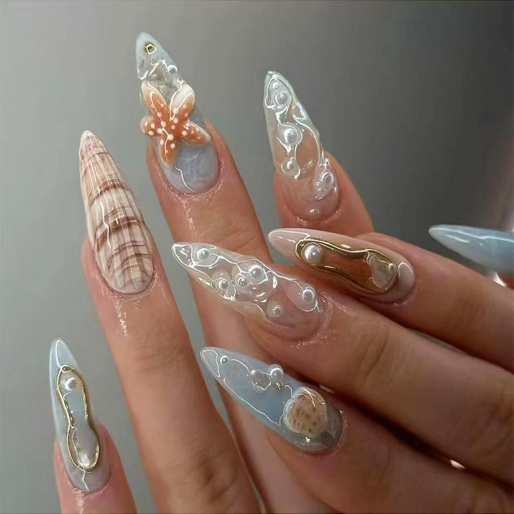Pearl ocean shell nails with 3D underwater details, glossy blue polish, and mermaid-inspired beach nail design
