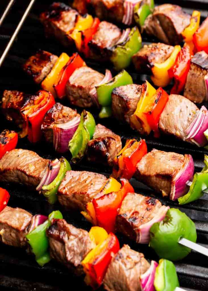 Grilled steak kabobs with colorful vegetables for an easy summer cookout dinner.