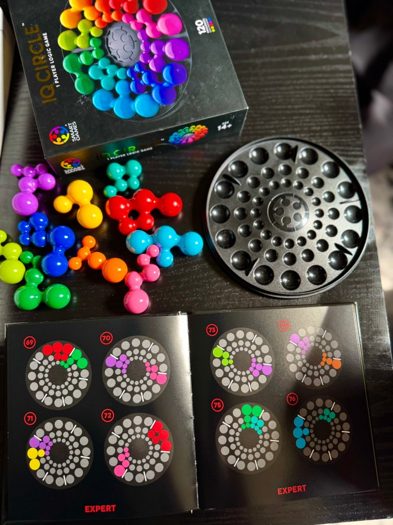 IQ Circle starter puzzle layout with colorful pieces arranged around the board