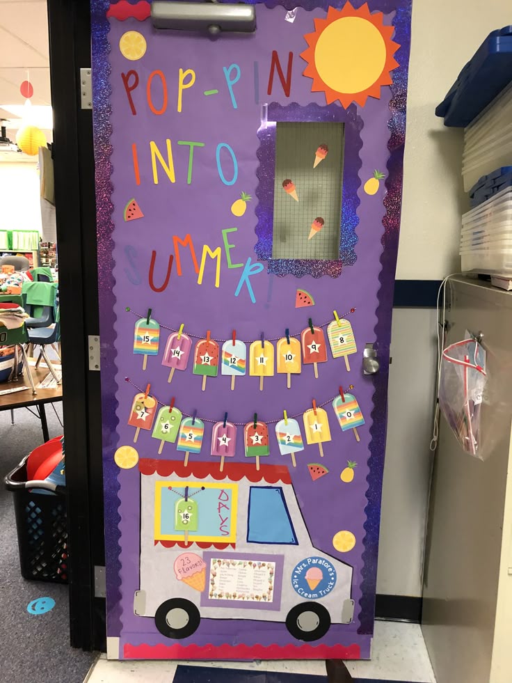 A colorful classroom door decorated with a summer theme featuring the words 'POP-PIN INTO SUMMER', ice cream cones, a sun, and an ice cream truck illustration. The door includes a countdown display with popsicle cutouts numbered 1 to 16.