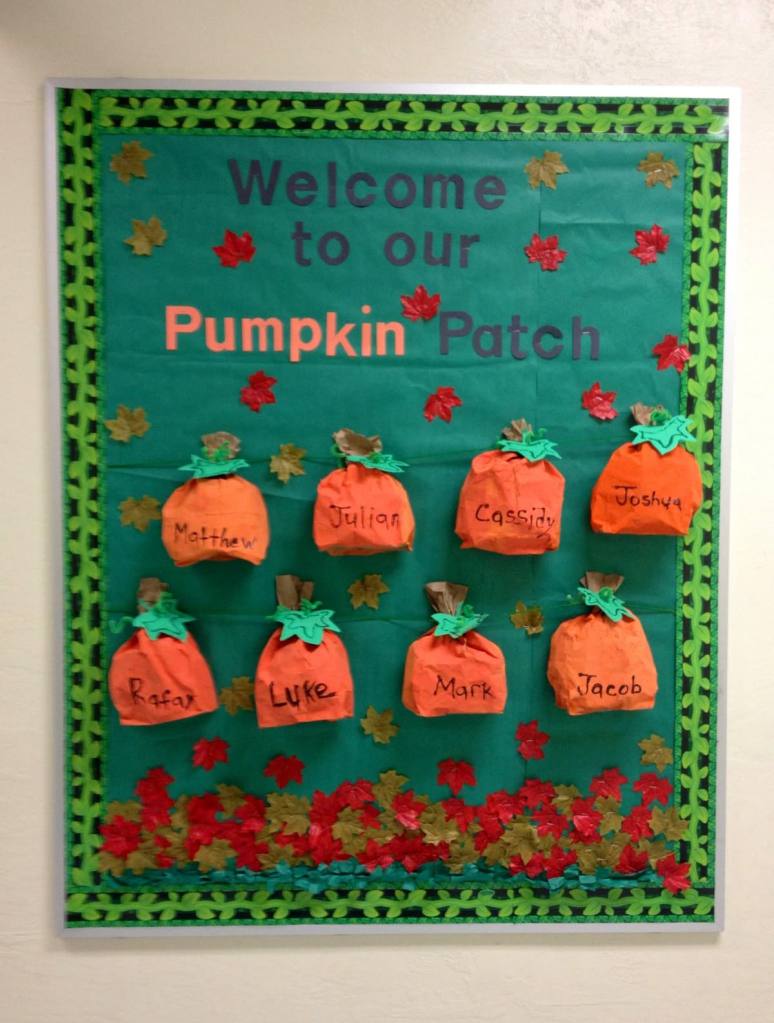 Fall bulletin board featuring student name pumpkins, colorful autumn leaves and a Welcome to Our Pumpkin Patch classroom display.