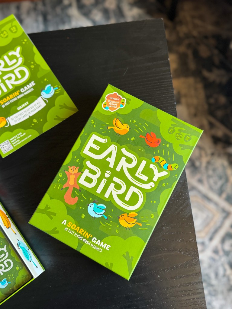Early Bird card game being played with number cards, challenge cards, and the worm piece