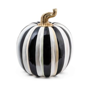 A stylish black and white striped pumpkin with a gold stem, perfect for fall decor.
