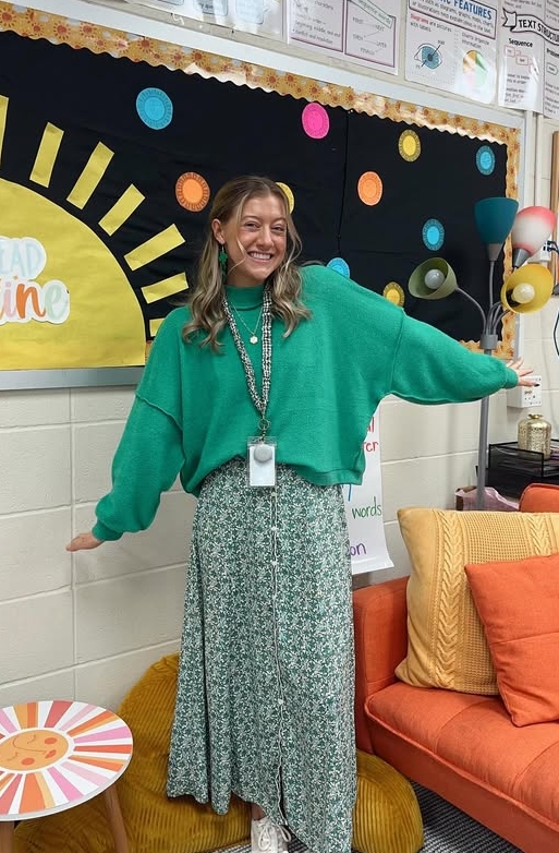 spring teacher outfit with green sweater and floral skirt