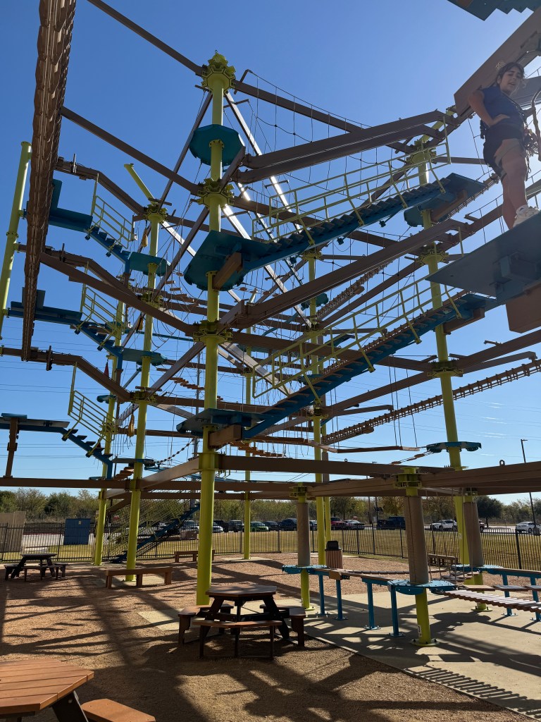 Outdoor ropes course at Great Wolf Lodge Grapevine featuring multiple levels of suspended bridges and climbing obstacles.