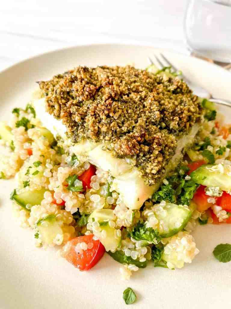 Baked cod with pesto crust for a simple and healthy summer seafood dinner.