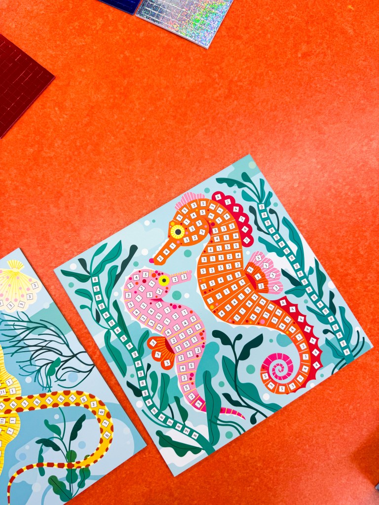 Numbered seahorse mosaic board used for visual matching and number recognition practice.