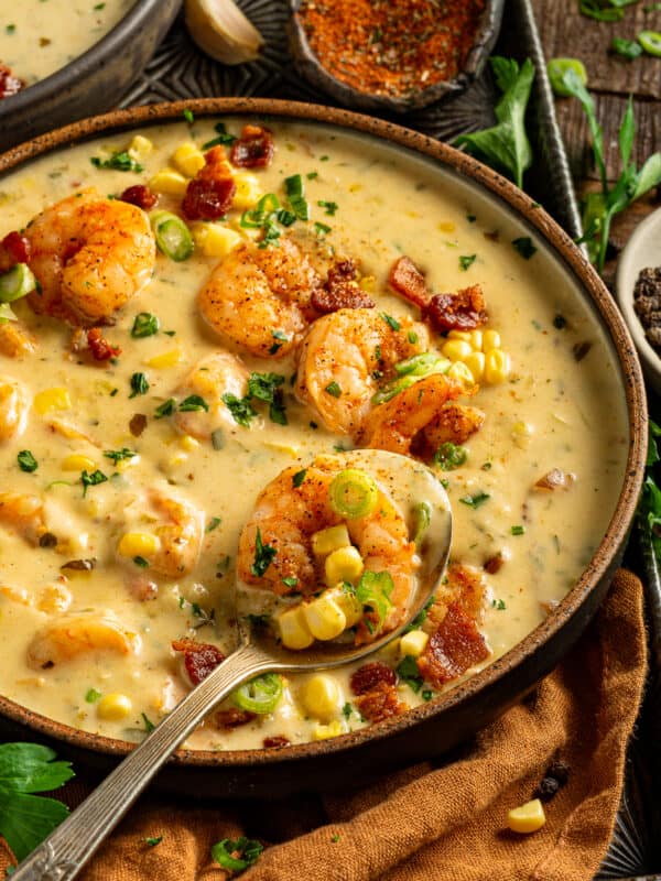 Rich New Orleans shrimp and corn bisque garnished with parsley and paprika