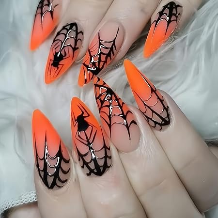 Bright orange nails featuring black spiderweb designs and a spider accent, showcasing a bold Halloween-themed manicure.