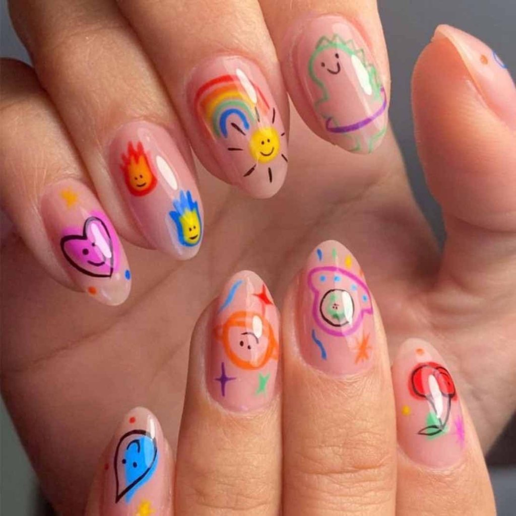 Close-up of decorated nails featuring colorful nail art, including smiley faces, hearts, rainbows, flowers, and stars on a nude background.