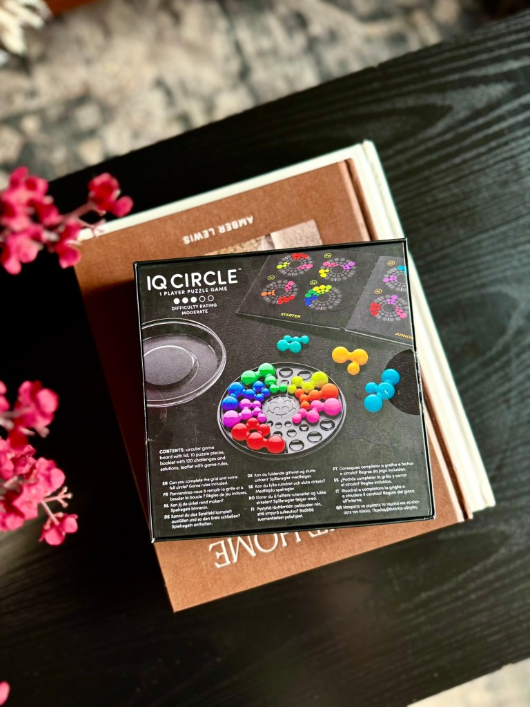Back of the IQ Circle puzzle game box showing the game board and challenge examples