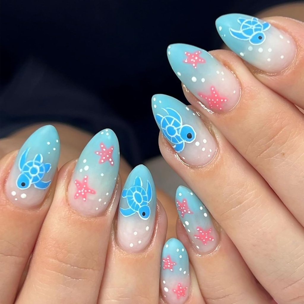 Pastel ocean turtle nails with sea turtle nail art, pink starfish accents, and soft beach-inspired colors