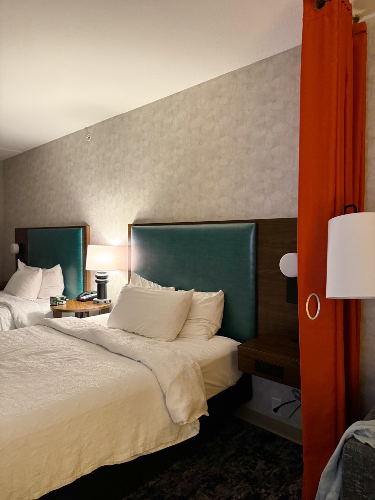 Guest room with two beds and colorful headboards at Home2 Suites Pigeon Forge.