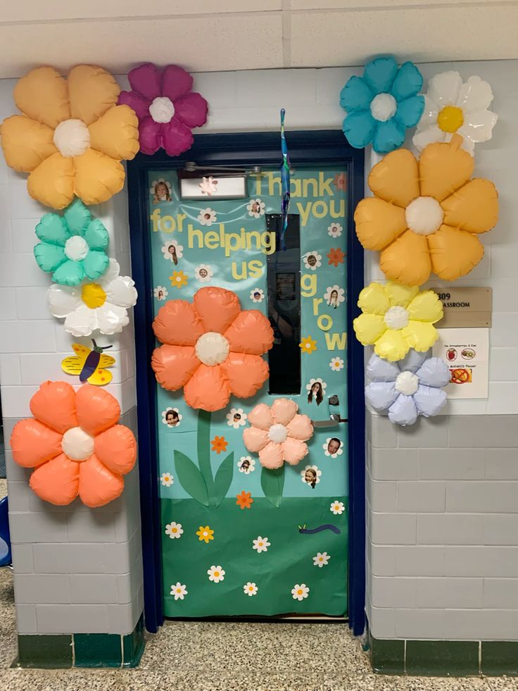 thanks for helping us grow classroom door with colorful flowers and garden theme