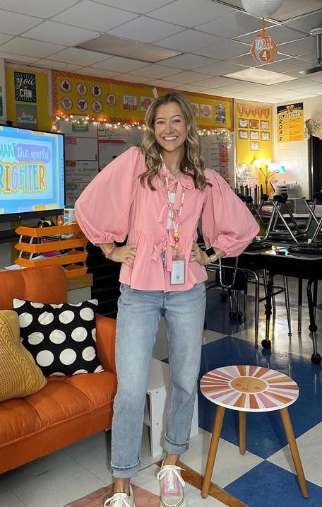 spring teacher outfit with pink blouse and jeans