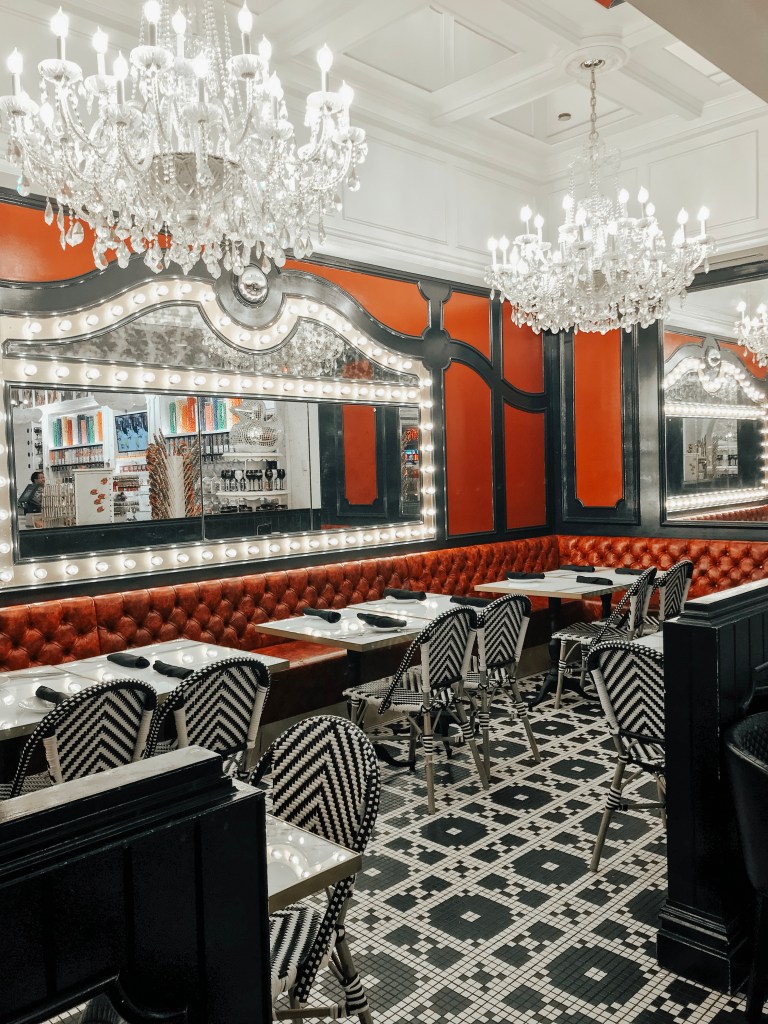 Crystal chandeliers hanging above the dining room at Sugar Factory Biloxi.