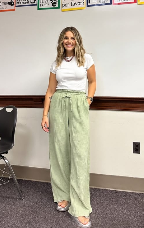 casual teacher outfit with white tee and green pants