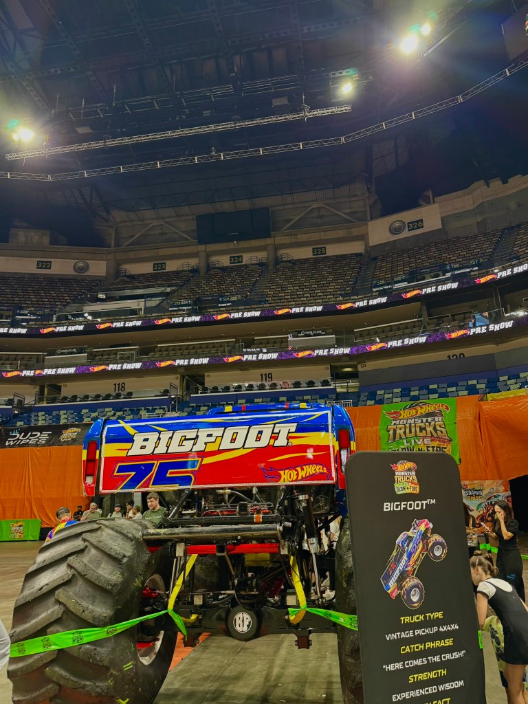 Rear view of the Bigfoot monster truck and its exposed frame during the preshow.