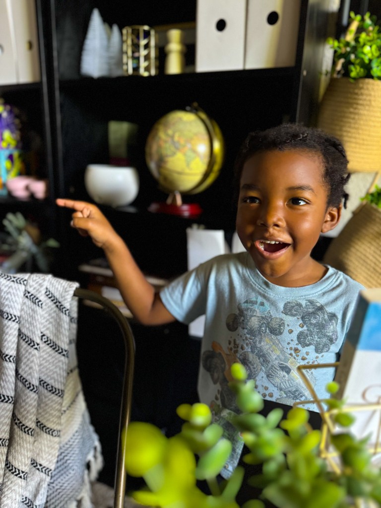 Child enjoying a hands-on homeschool phonics activity with movement and letter sounds