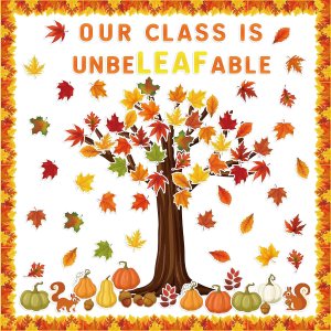A colorful autumn-themed classroom decoration featuring a tree with orange, red, and yellow leaves. The text 'OUR CLASS IS UNBELEAFABLE' is displayed in the center, surrounded by scattered leaves, pumpkins, and squirrels.
